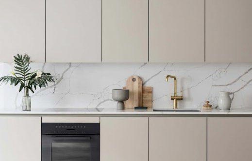 artist rendering of kitchen beige painted cabinets, veined marble quartz counters and backsplash, and sink detail